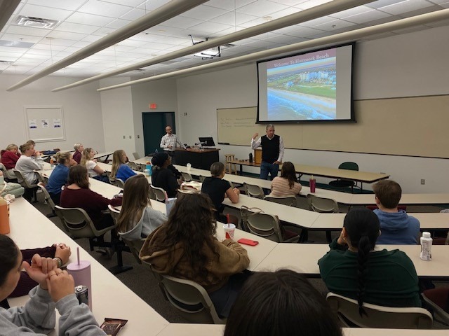 instructor talking to students in class