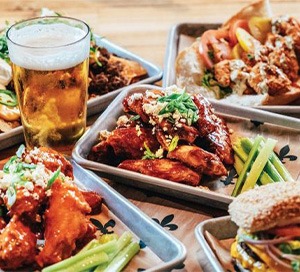 plates of chicken and glass of beer