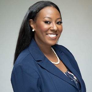 woman smiling, swearing blue sport coat