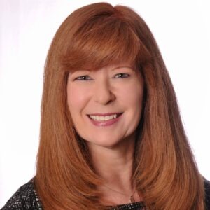 close up of woman with red hair smiling