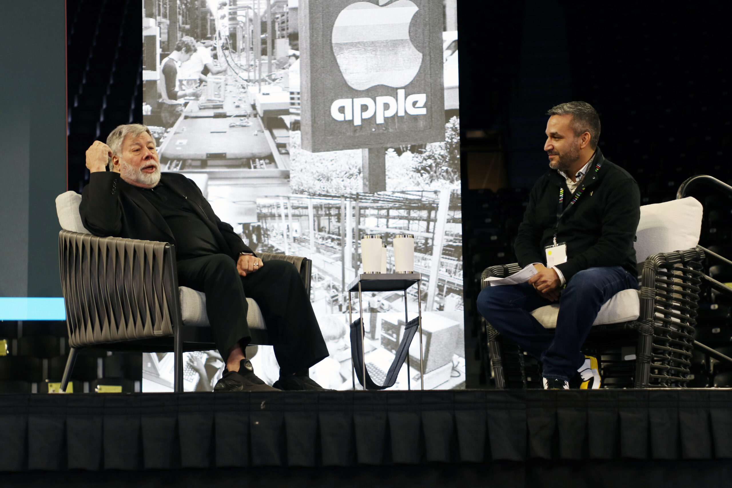 two men on stage talking