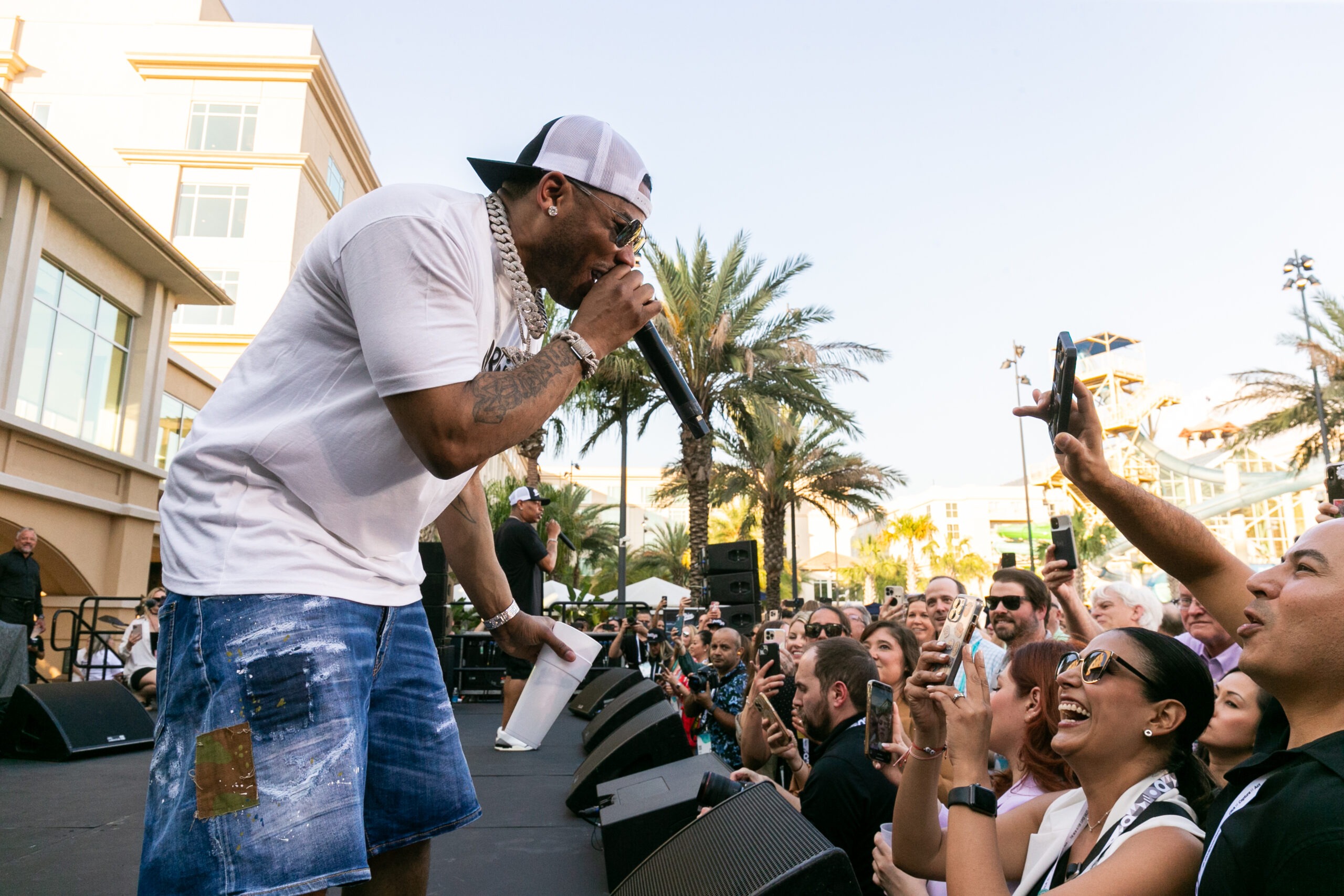 man performing on stage in front of crowd