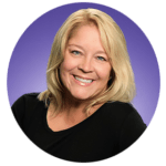 woman with black shirt smiling with purple background