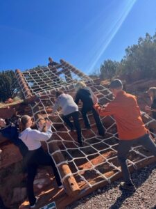 people climbing ropes