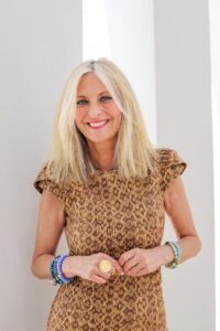 woman wearing light and dark brown patterned shirt