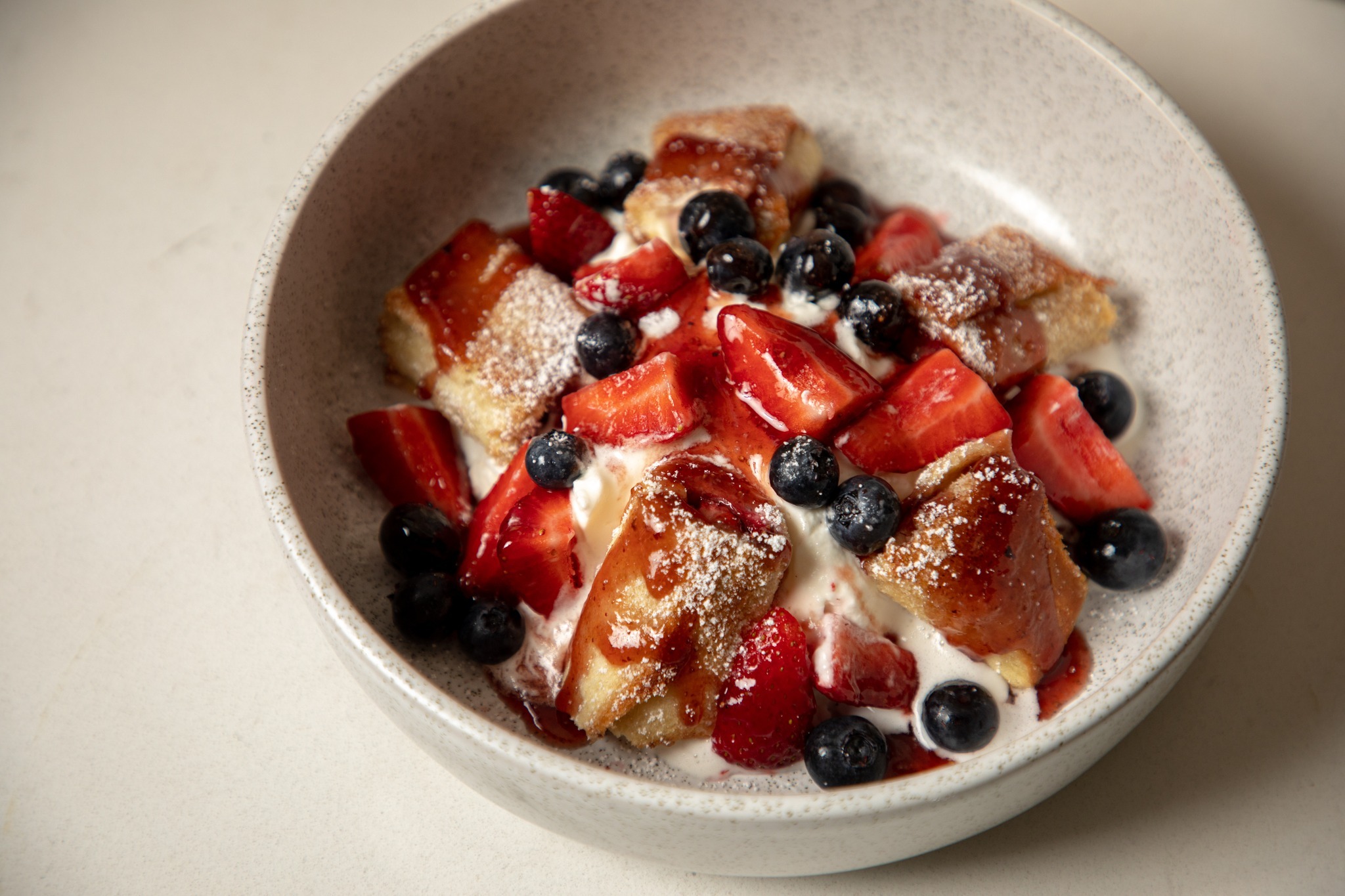 bowl filled with strawberries and blueberries