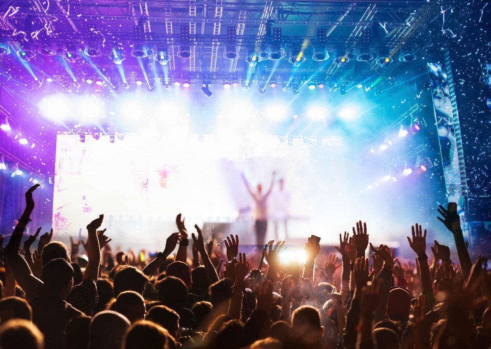 large crowd at music festival at night