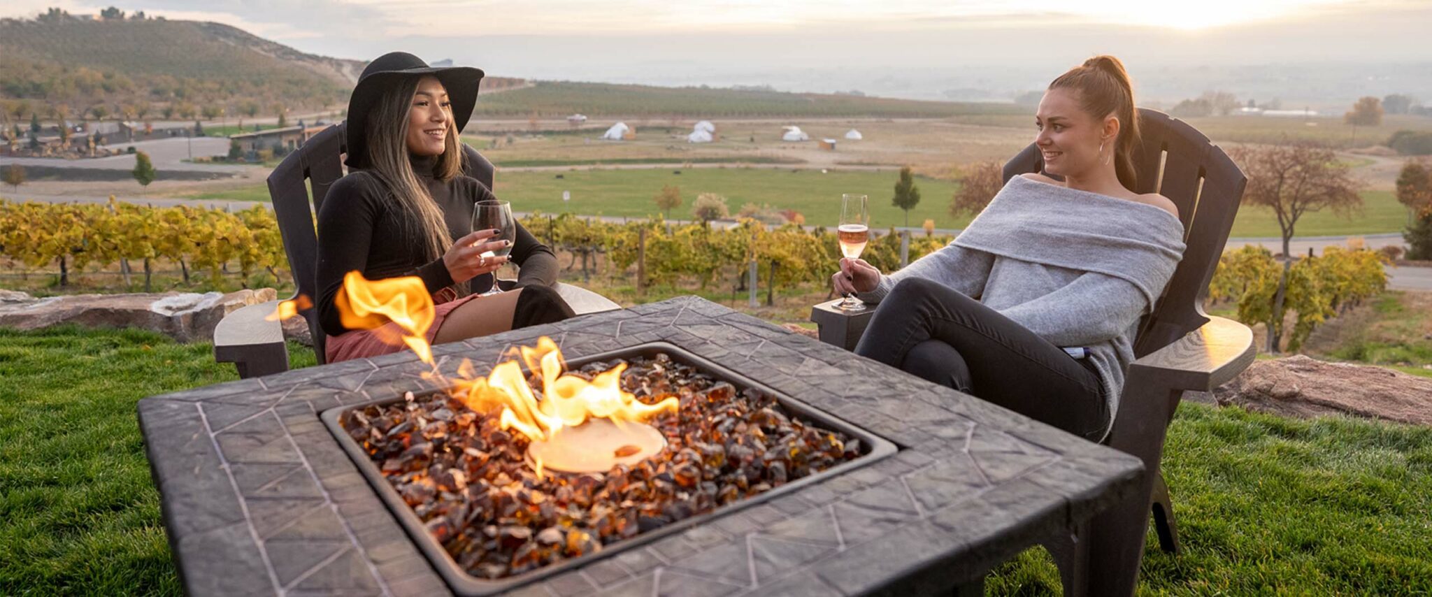 two women hatting by the fire in Boise