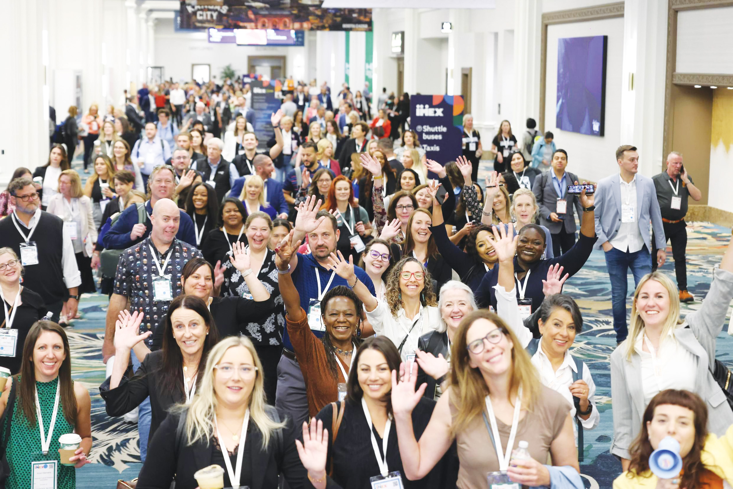 large group of people waving