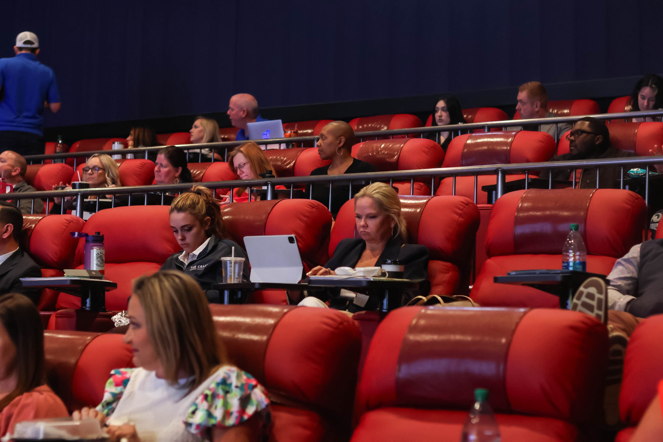 Attendees sitting in theatre for meeting, photo courtesy of Galaxy Theatres Grandscape