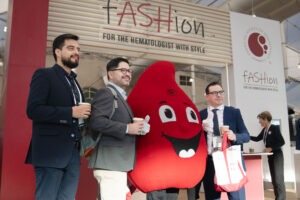 three people and person dressed as red character