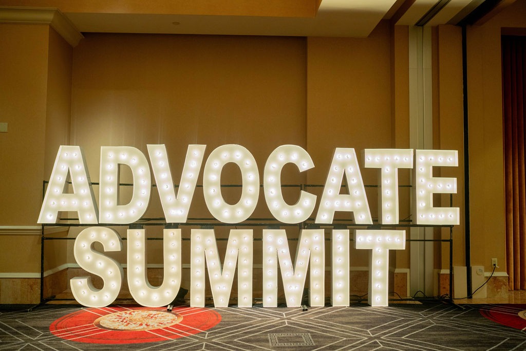 Lighted "advocate summit" sign