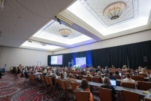 people listening to speaker at healthcare advocate summit