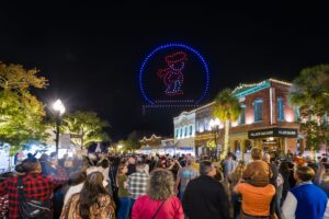 People watching drone show at Dickens on Centre