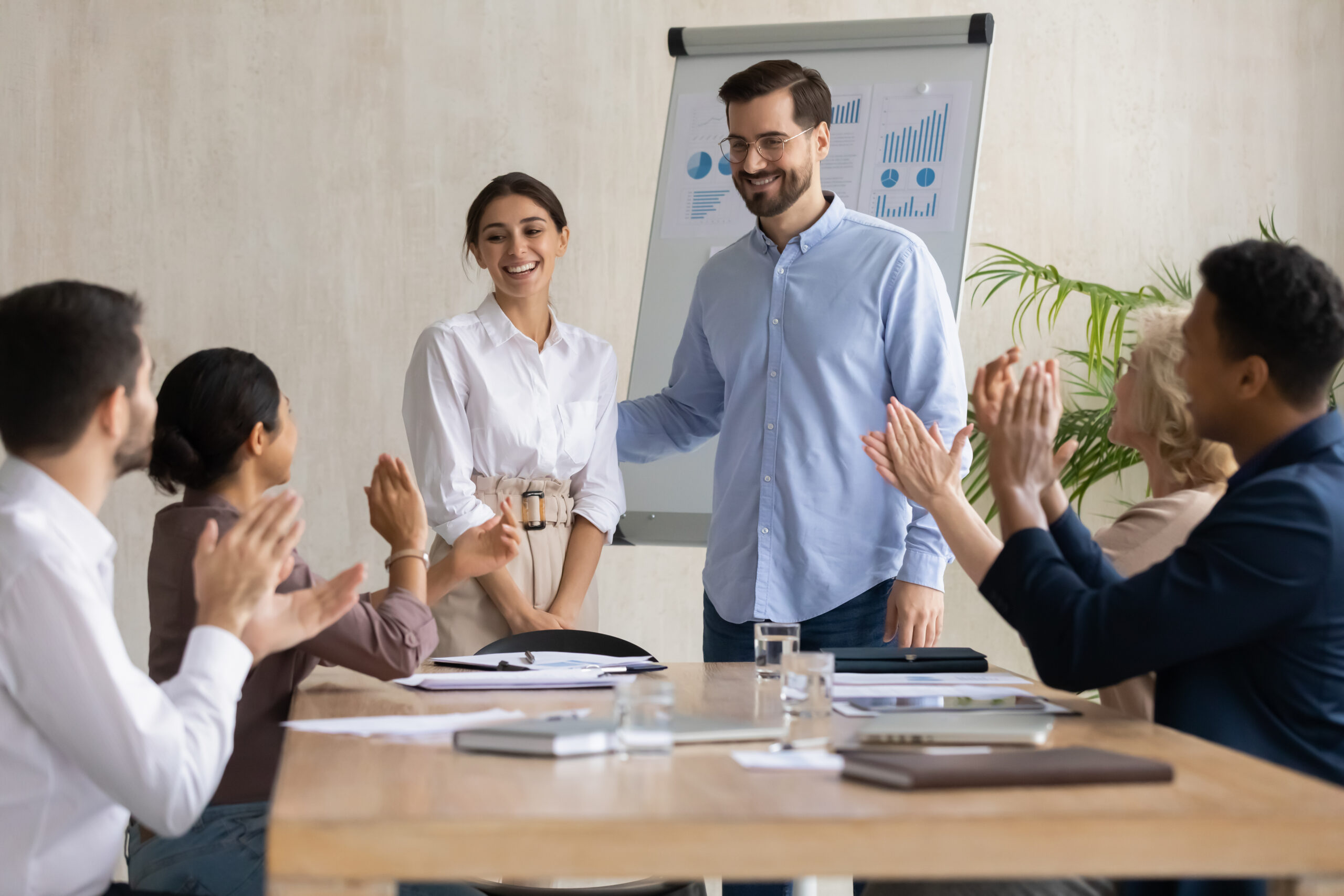 Leadership supporting their employee with fellow coworkers