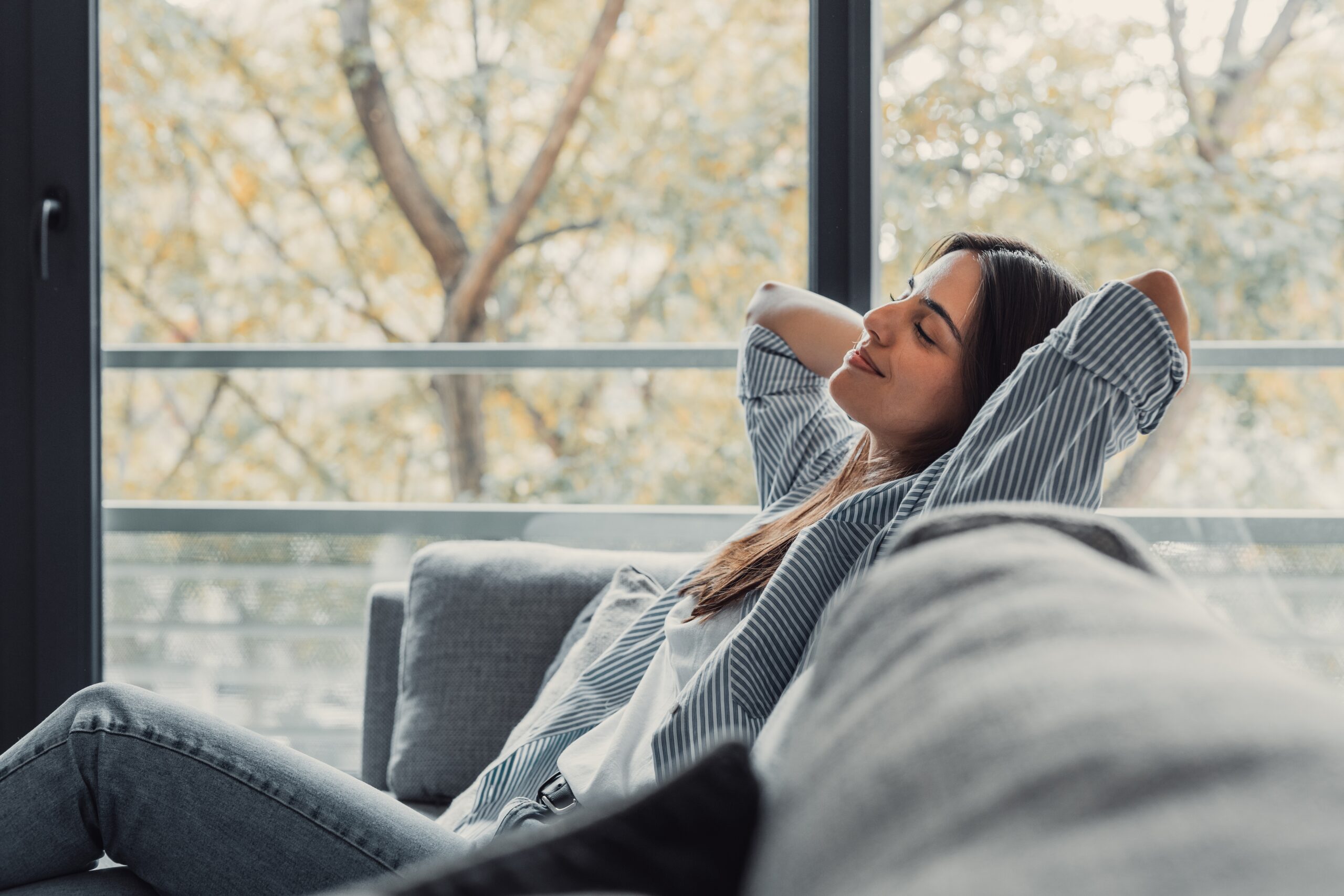 woman relaxing on couch